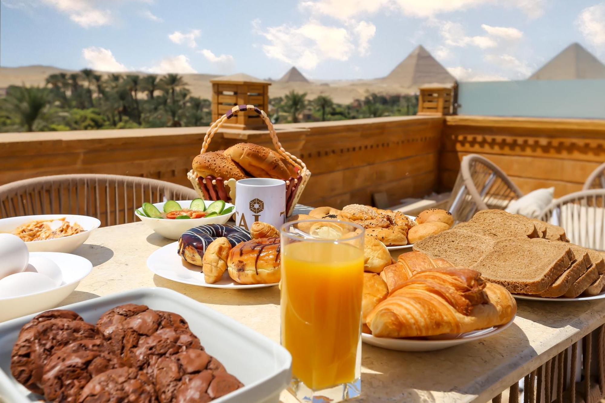 Taj Pyramids View Inn Kafret el-Gabal エクステリア 写真