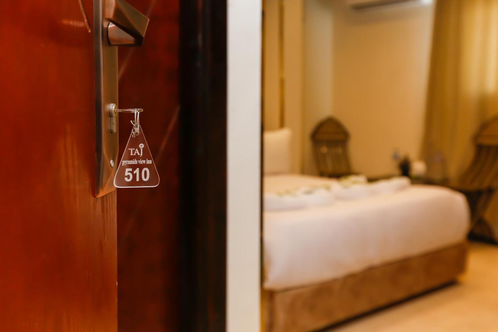 Taj Pyramids View Inn Kafret el-Gabal エクステリア 写真