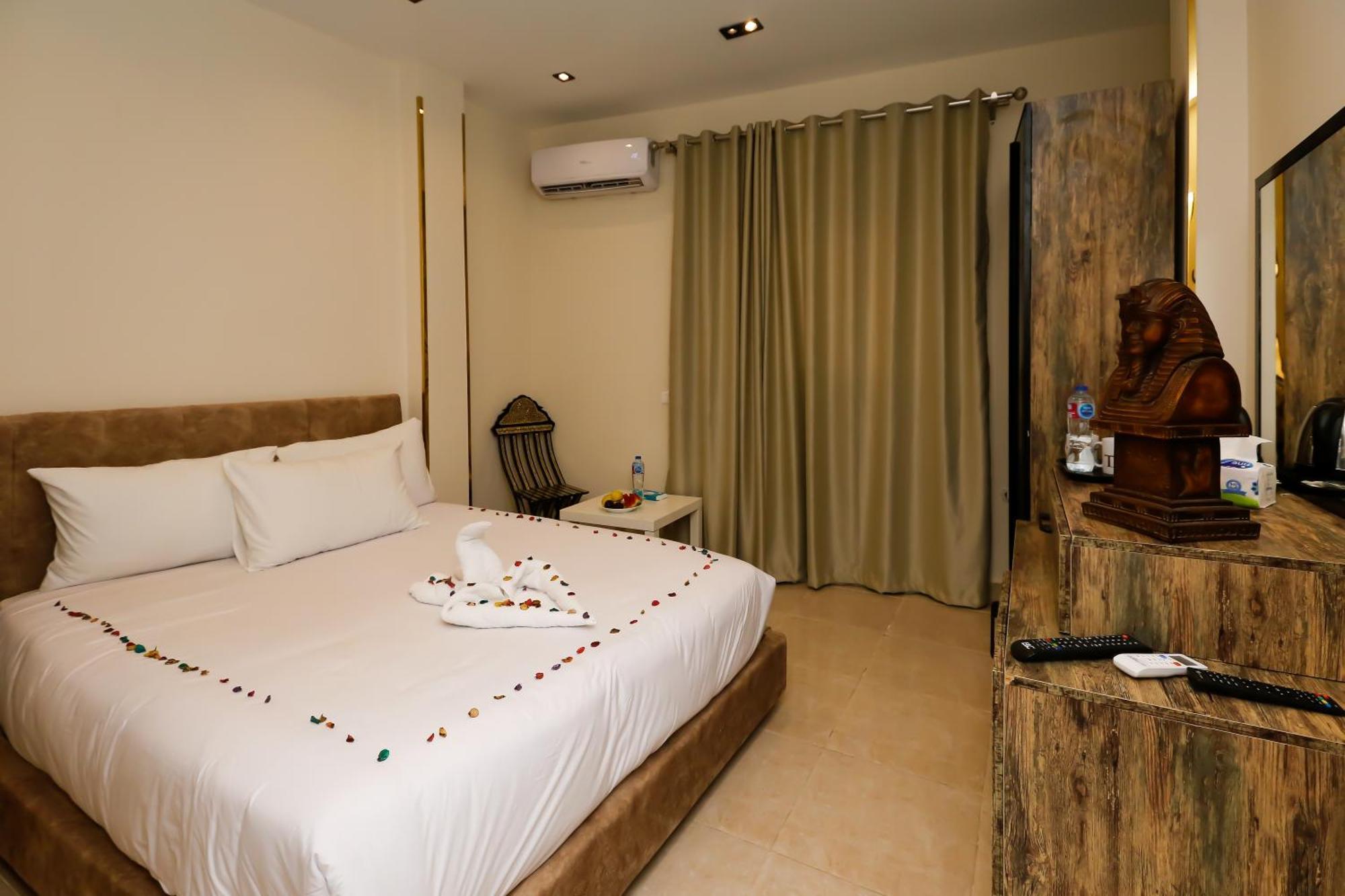 Taj Pyramids View Inn Kafret el-Gabal エクステリア 写真